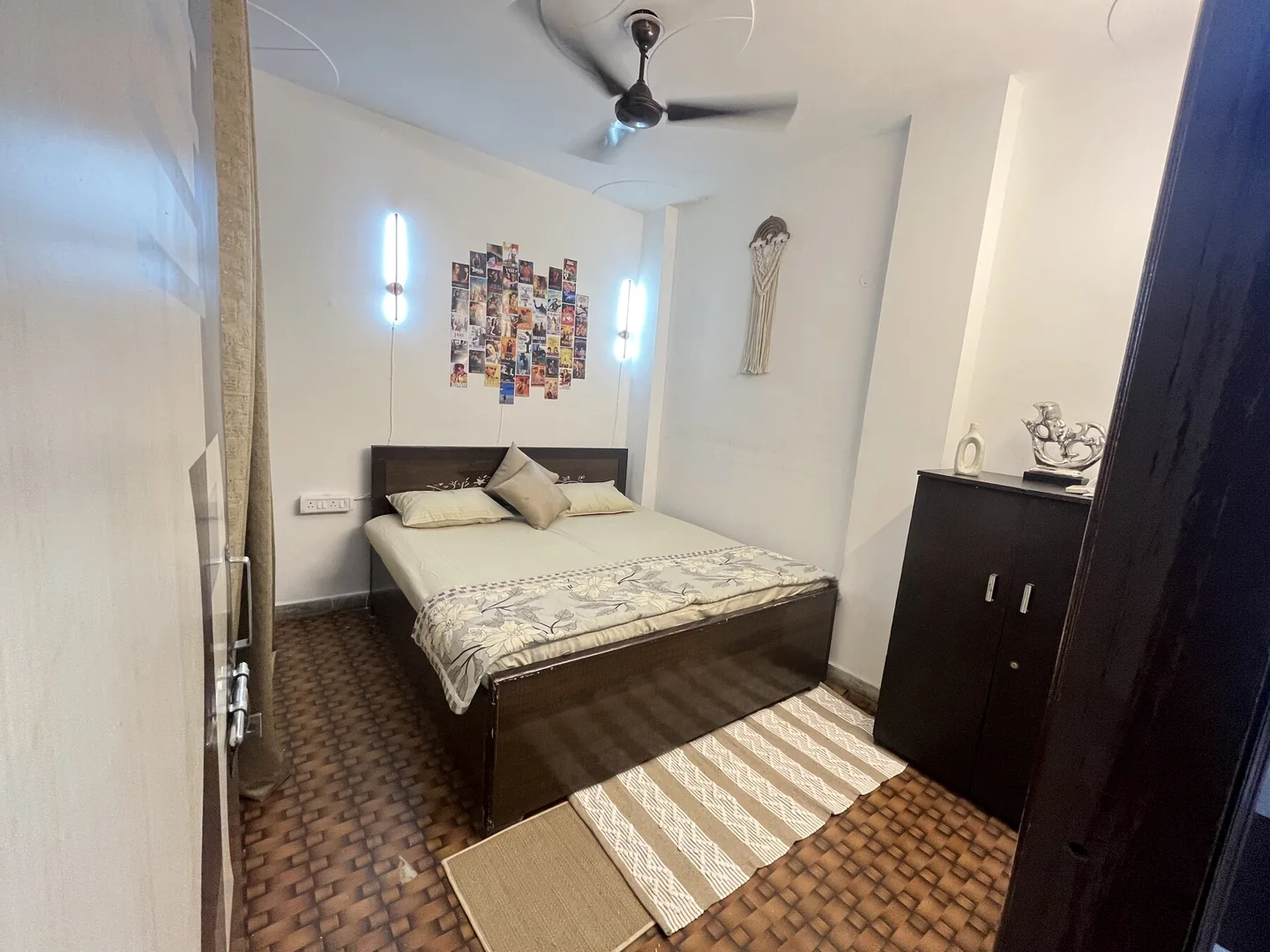 King bedroom with Bollywood art wall at Urban Serenity