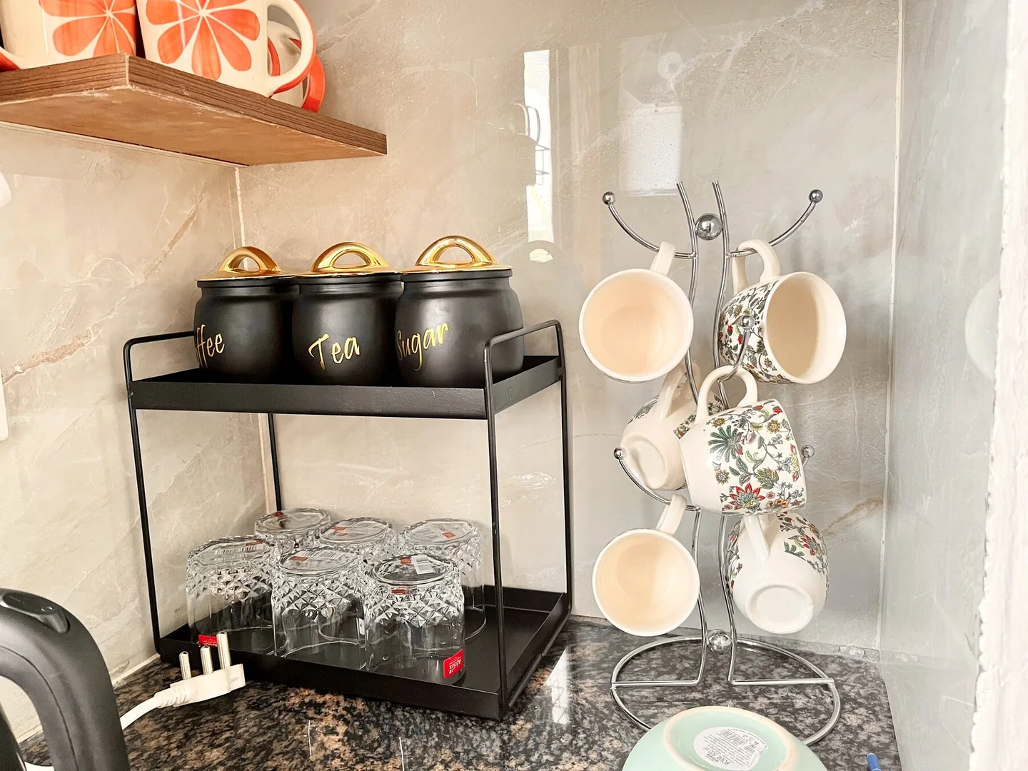 Organised tea, sugar, crockery and cooking storage